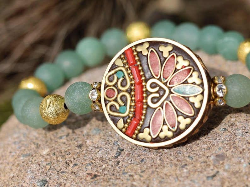 Beautiful combination. Frosted Round Natural Green Aventurine Beads bracelet combined with Gold Carved Brass Metal Loose Beads.