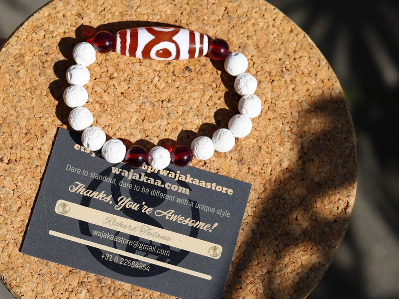 Energy Tibetan Red Agate 3 Eye Big Wisdom bracelet with  white lava beads  and 4x Red Agate beads. Surrounded by myth and mystery