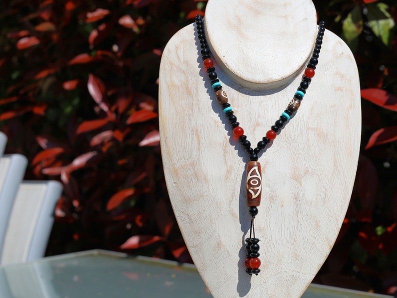 Eye Dzi pattern necklace with 2 eyed dzi and and a Agate Stone beaded necklace. The longer the Dzi exist, the more potent it becomes