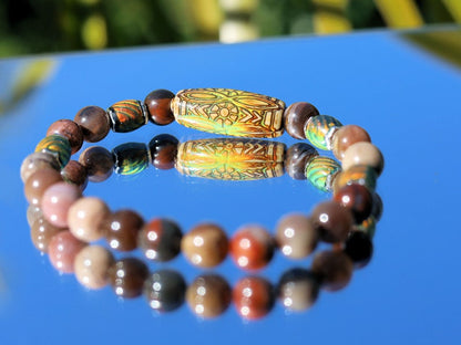 Color-changing Mirāja collection. Natural Petrified Wood Stone Beaded bracelet with Mood Daisy Ray Bead, Sensing Color Changing barrel beads