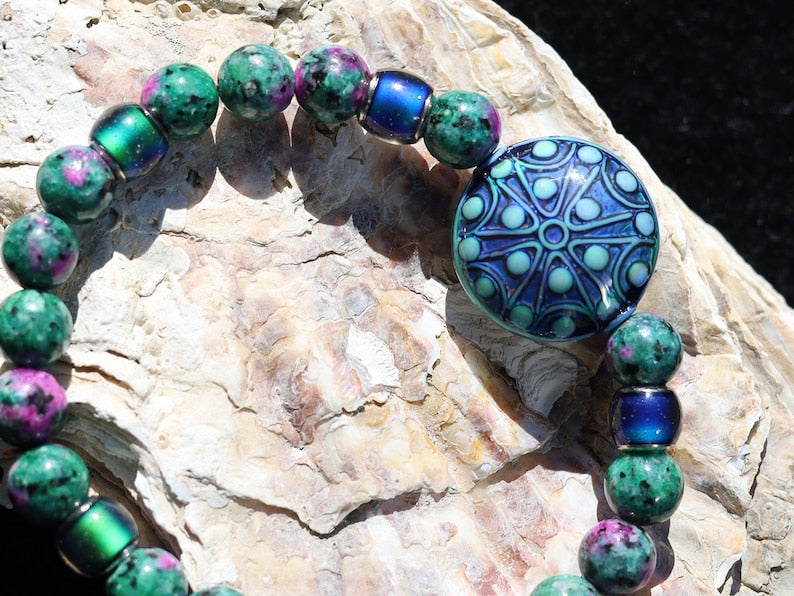 Color-changing Mirāja collection. Colorful Persian Jade bracelet with Mirage Mood Stargazer Coin Bead. unique colors in every environment