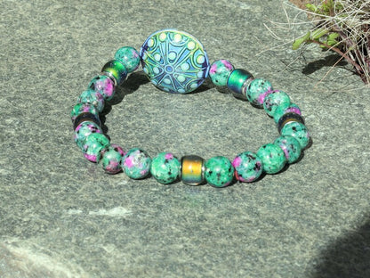 Color-changing Mirāja collection. Colorful Persian Jade bracelet with Mirage Mood Stargazer Coin Bead. unique colors in every environment