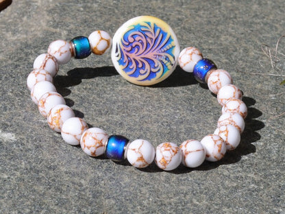 Color-changing Mirāja collection. White Turquoise Gold Color Wire Pine bracelet. Mirage Mood Fountain Fern Coin and Changing barrel beads.