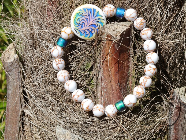 Color-changing Mirāja collection. White Turquoise Gold Color Wire Pine bracelet. Mirage Mood Fountain Fern Coin and Changing barrel beads.