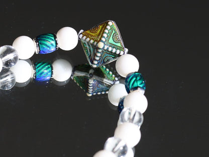 Color-changing Mirāja collection.  White Onyx  Agate bracelet with Mirage Mood Northern Lights Diamond Bead and Color Changing barrel beads