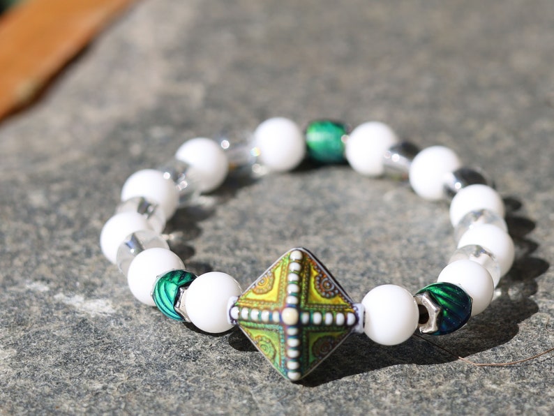 Color-changing Mirāja collection.  White Onyx  Agate bracelet with Mirage Mood Northern Lights Diamond Bead and Color Changing barrel beads