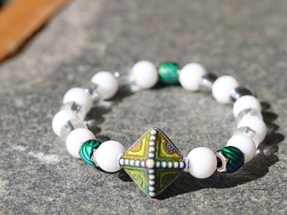 Color-changing Mirāja collection.  White Onyx  Agate bracelet with Mirage Mood Northern Lights Diamond Bead and Color Changing barrel beads