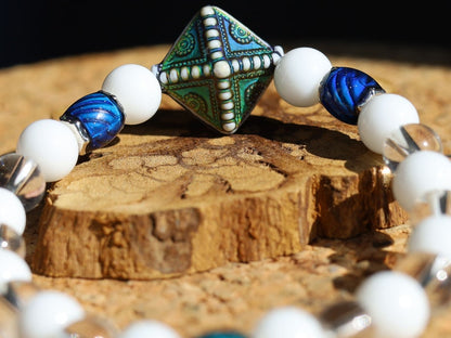 Color-changing Mirāja collection.  White Onyx  Agate bracelet with Mirage Mood Northern Lights Diamond Bead and Color Changing barrel beads