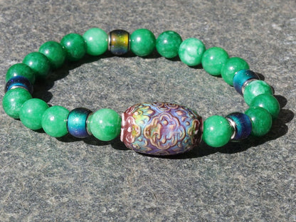 Color-changing Mood Mirāja collection. Green Chalcedony Stone bracelet with Mirage Mood Daisy Ray Bead and  Color Changing barrel beads.