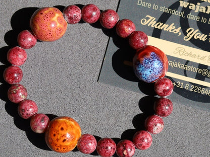 Unique Gorgeous Aggie Maroon Jade Beads bracelet with 16 mm red/ orange beads. Meaningful & symbolic merchandise. Durable stretchy cord