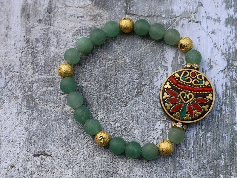 Beautiful combination. Frosted Round Natural Green Aventurine Beads bracelet combined with Gold Carved Brass Metal Loose Beads.