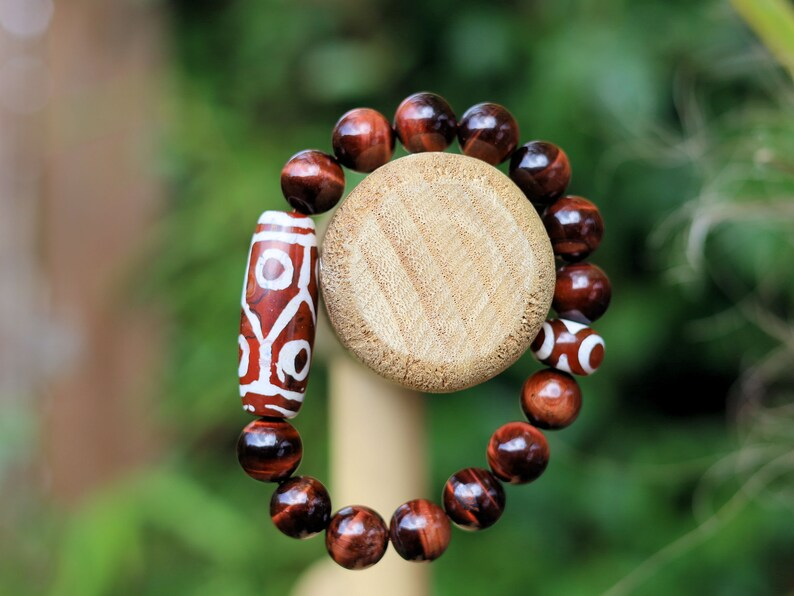 12 mm Red Tiger's Eye beaded bracelet with unique Red/ white big Dzi 6 eyes.  often used in prayer and meditation practices