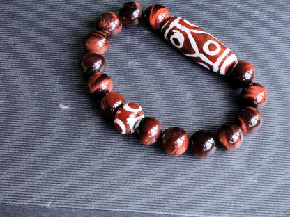 12 mm Red Tiger's Eye beaded bracelet with unique Red/ white big Dzi 6 eyes.  often used in prayer and meditation practices