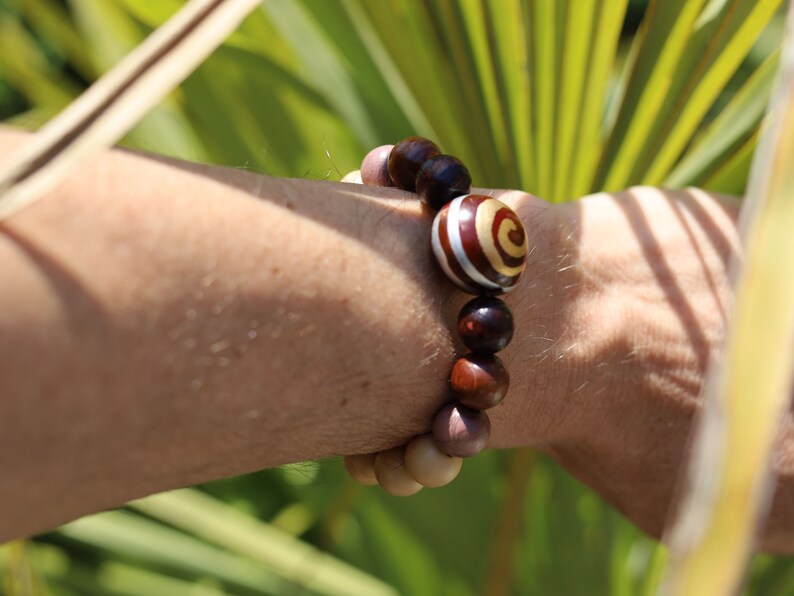 Wooden Spiral bead combined with maple and hornbeam wood. Cultural or Spiritual Significance. a form of self-expression