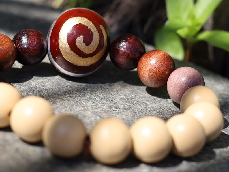 Wooden Spiral bead combined with maple and hornbeam wood. Cultural or Spiritual Significance. a form of self-expression