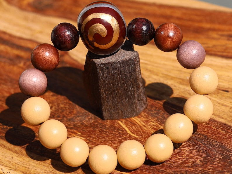 Wooden Spiral bead combined with maple and hornbeam wood. Cultural or Spiritual Significance. a form of self-expression