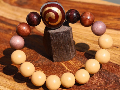 Wooden Spiral bead combined with maple and hornbeam wood. Cultural or Spiritual Significance. a form of self-expression