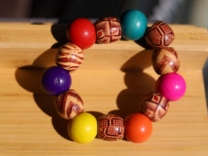 Wooden Lots of colour Fashionable bracelet. A trendy wooden bracelet with various colors and models of wooden beads