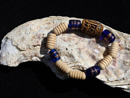 Wooden Turned  beads with Glass bead cobalt blue tubes. And reat authentic look & feel - carved decoration of a Lotus flower