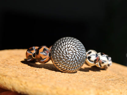 Unique Silver color metal look coin with cable motif with mixed rare  Leather Beads. it can symbolize a connection to the natural world