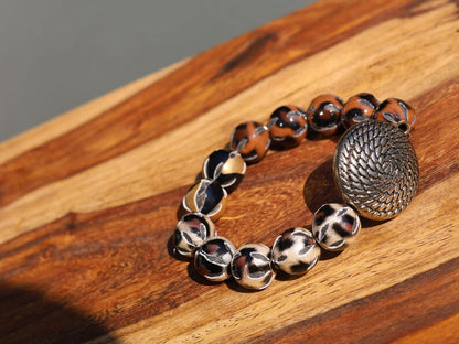 Unique Silver color metal look coin with cable motif with mixed rare  Leather Beads. it can symbolize a connection to the natural world