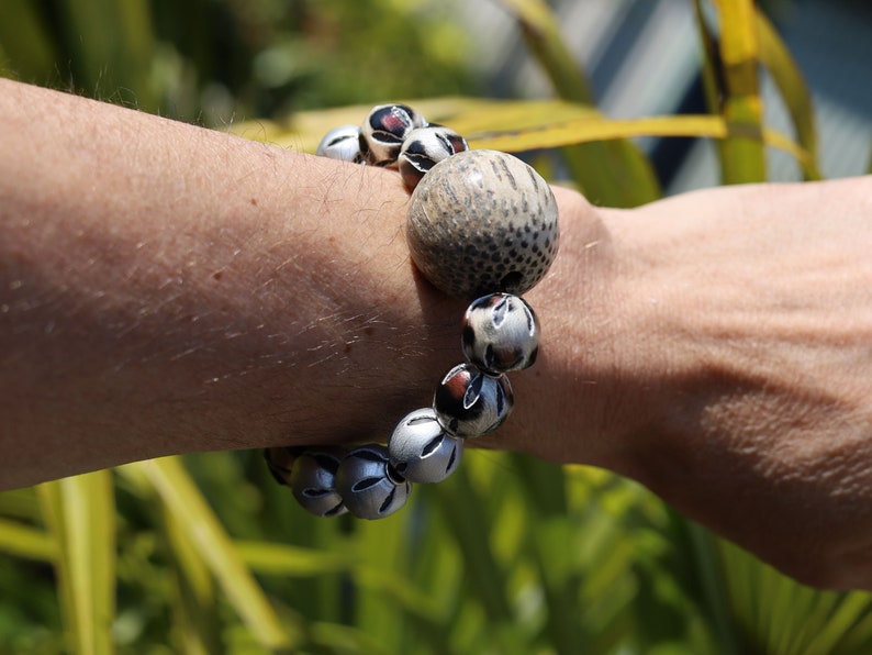 Unique big Palmwood ball brown/ grey, 29 mm with mixed rare Leather Beads. it can symbolize a connection to the natural world