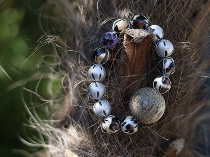 Unique big Palmwood ball brown/ grey, 29 mm with mixed rare Leather Beads. it can symbolize a connection to the natural world