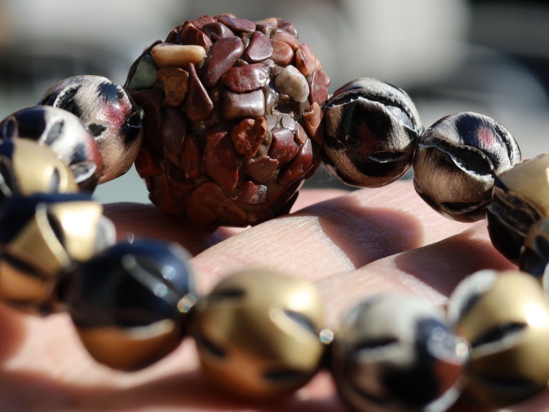 Chunk bead brown stone covered with different light brown colored stones. Combined with Mixed colors Leather Beads.