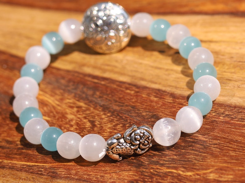 White Line Collection: Blue and white Cat's Eye Selenite bracelet with Tibetan Style Alloy Beads and a Pixiu