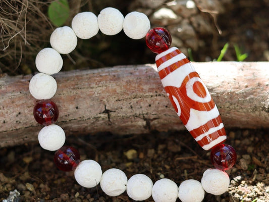 Energy Tibetan Red Agate 3 Eye Big Wisdom bracelet with  white lava beads  and 4x Red Agate beads. Surrounded by myth and mystery