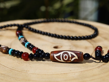 Eye Dzi pattern necklace with 2 eyed dzi and and a Agate Stone beaded necklace. The longer the Dzi exist, the more potent it becomes