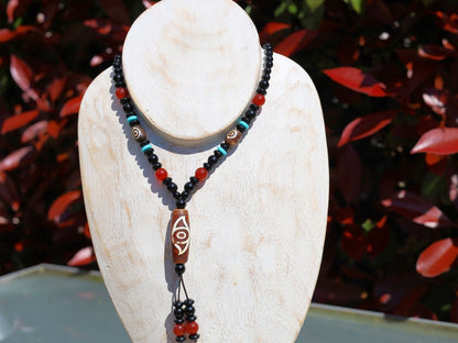 Eye Dzi pattern necklace with 2 eyed dzi and and a Agate Stone beaded necklace. The longer the Dzi exist, the more potent it becomes