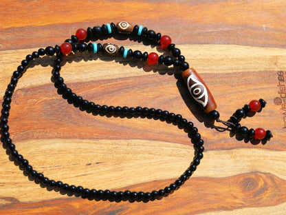 Eye Dzi pattern necklace with 2 eyed dzi and and a Agate Stone beaded necklace. The longer the Dzi exist, the more potent it becomes