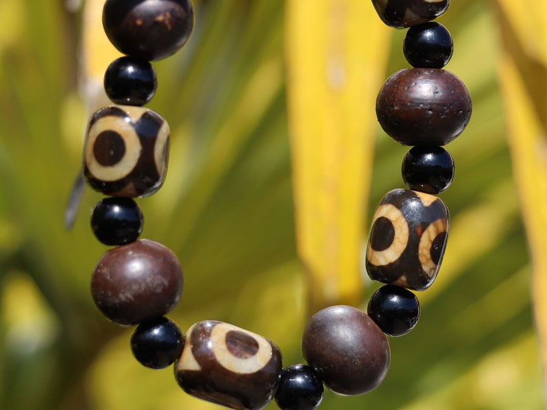 Jewelry set. 3-eyed black and white dzi necklace and bracelet. Wearing a 3-eye dzi bead  is believed to promote spiritual well-being