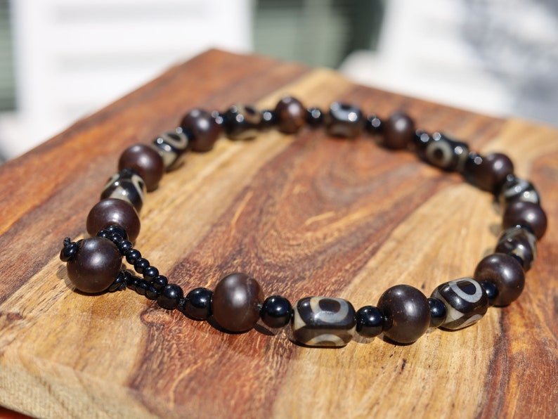 Jewelry set. 3-eyed black and white dzi necklace and bracelet. Wearing a 3-eye dzi bead  is believed to promote spiritual well-being