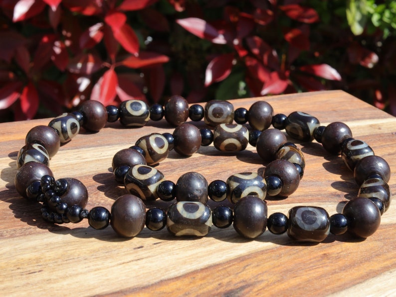 Jewelry set. 3-eyed black and white dzi necklace and bracelet. Wearing a 3-eye dzi bead  is believed to promote spiritual well-being