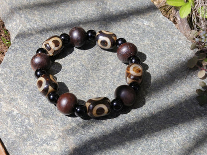 Jewelry set. 3-eyed black and white dzi necklace and bracelet. Wearing a 3-eye dzi bead  is believed to promote spiritual well-being
