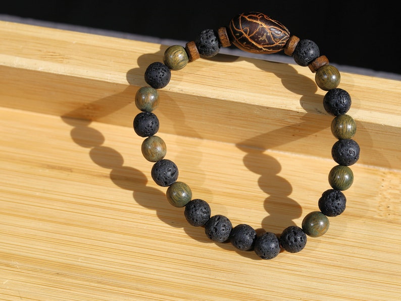 Kili seed bracelet with Lava and Olive Green Round Natural Wood Beads. Beautiful Disc coconut beads. Diffuser bracelets