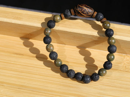 Kili seed bracelet with Lava and Olive Green Round Natural Wood Beads. Beautiful Disc coconut beads. Diffuser bracelets