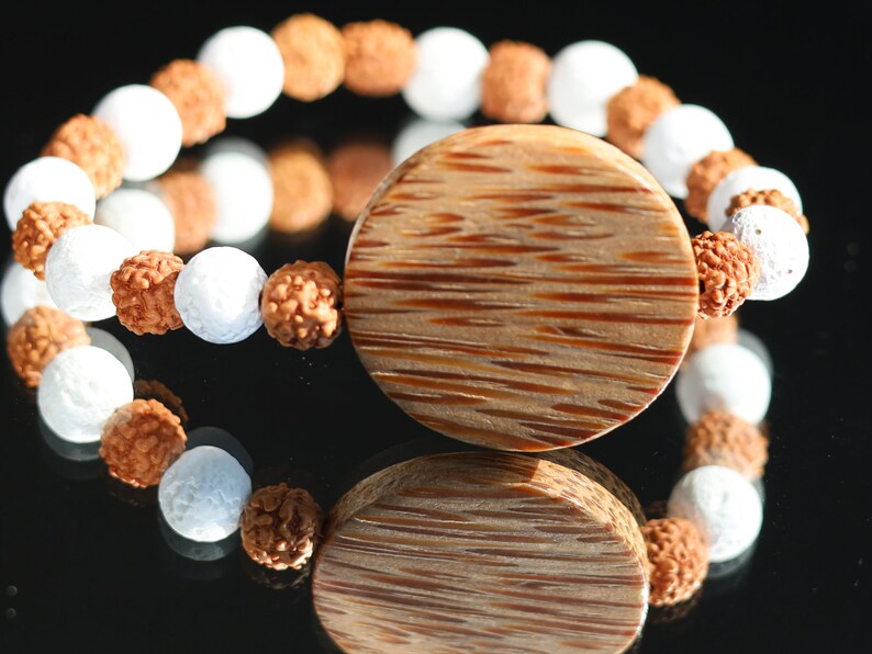Beautiful, large Palm Wood bead with Lava and Round Rudraksha beads. Overall, white lava beads offer a unique  element to jewelry designs