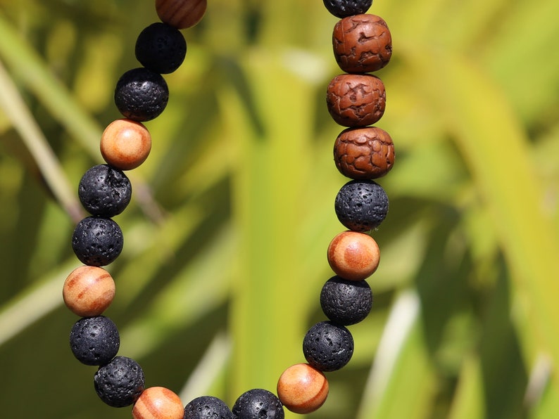 Polished Rudraksha bracelet with Raja Kayu and Lav beads.  the Supreme King in the forest among all different pieces of trees