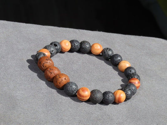 Polished Rudraksha bracelet with Raja Kayu and Lav beads.  the Supreme King in the forest among all different pieces of trees