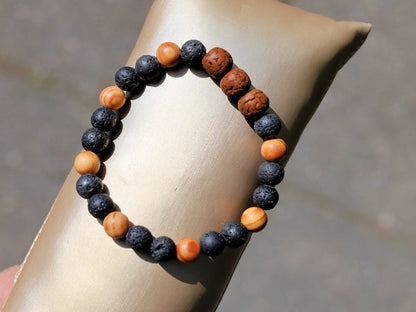 Polished Rudraksha bracelet with Raja Kayu and Lav beads.  the Supreme King in the forest among all different pieces of trees
