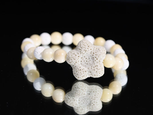 Acai broken white seed beaded bracelet with white lava and Off White/Sand color Flower shaped  bead. Enjoying Aromatherapy