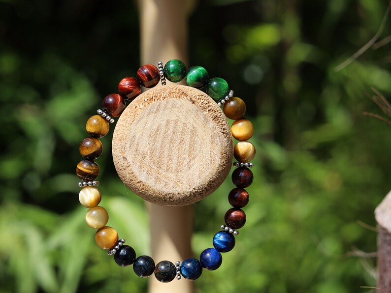 Multi colored tiger eye bead bracelet combined with FLAT SQUARE tibetan Style Alloy Pearl Spacer Discs. Outstanding and Astonishing.