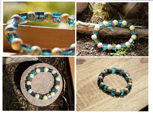 Glass beaded bracelet with a special color coating. Mix Colors Ø8mm. With Cosmic Cube bead 8x8mm Azure w Pink. Total weight approx 29 gr.