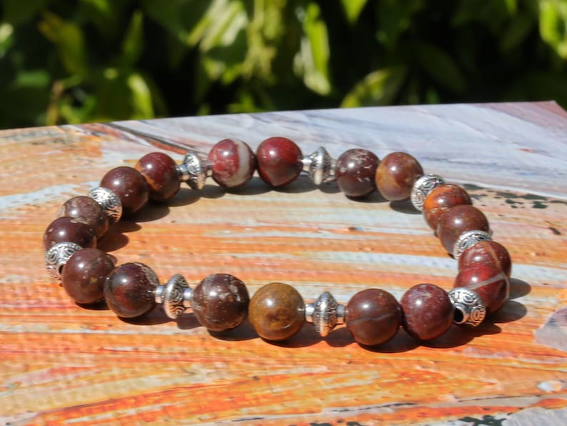 Red Brecciated Jasper bracelet with Tibetan Style Alloy Pearl Spacer Discs. Tibetan alloy material in antique silver.