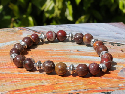 Red Brecciated Jasper bracelet with Tibetan Style Alloy Pearl Spacer Discs. Tibetan alloy material in antique silver.