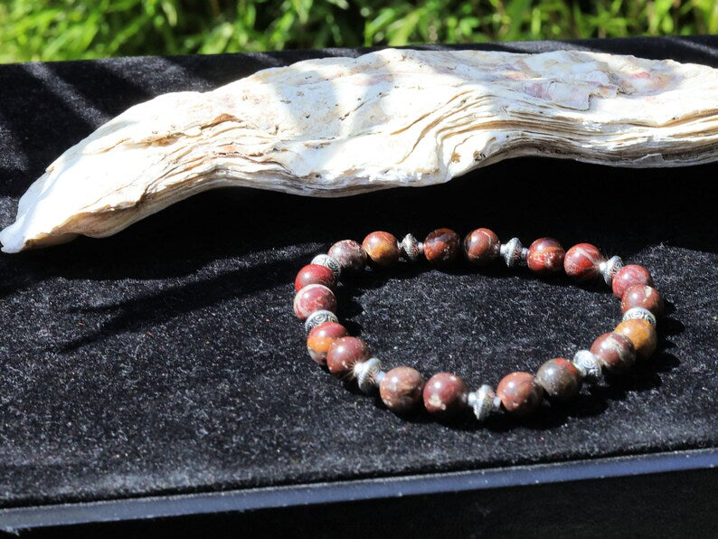 Red Brecciated Jasper bracelet with Tibetan Style Alloy Pearl Spacer Discs. Tibetan alloy material in antique silver.