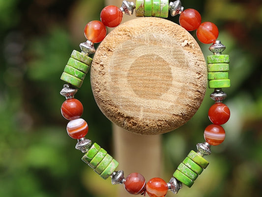 Green Sea Sediment Jasper Gemstone Heishi Spacer bracelet with Banded orange beads. different from what is commonly seen or expected